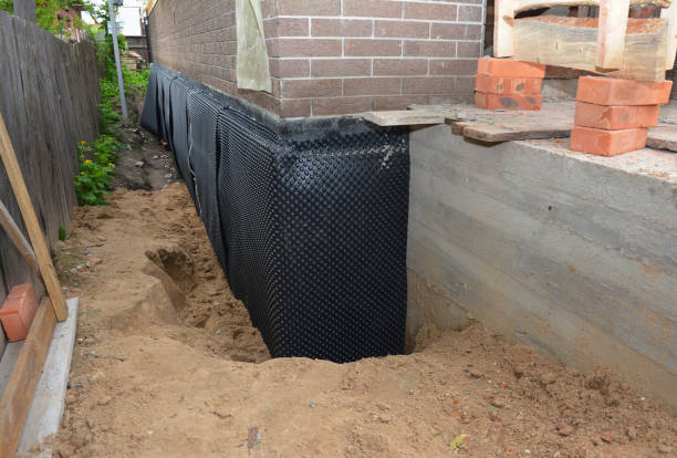 Happy homeowners after waterproofing job in Havertown